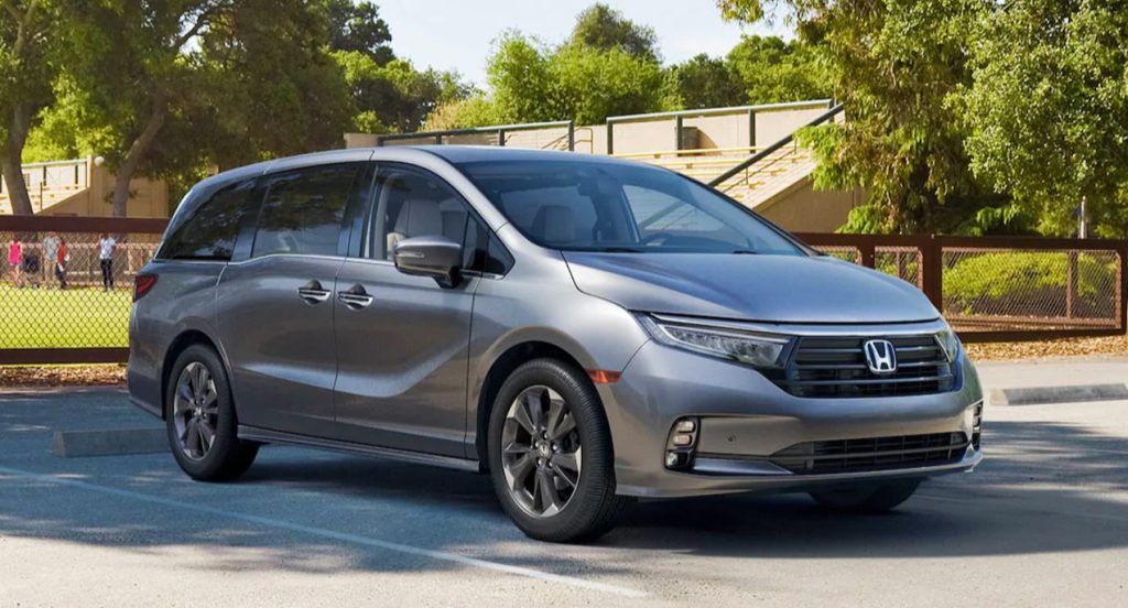 A gray 2022 Honda Odyssey minivan is parked.