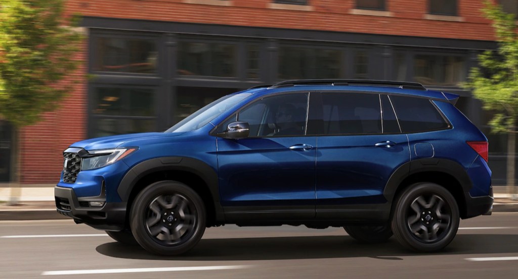 A blue 2022 Honda Passport Elite midsize SUV.