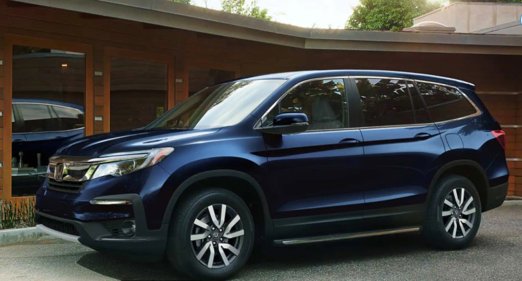 A dark blue 2022 Honda Pilot full-size SUV. 