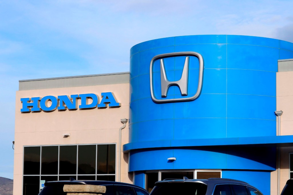 Honda dealership, where the 2022 Honda Passport Trailsport is sold, with the blue section and Honda logo on the building.