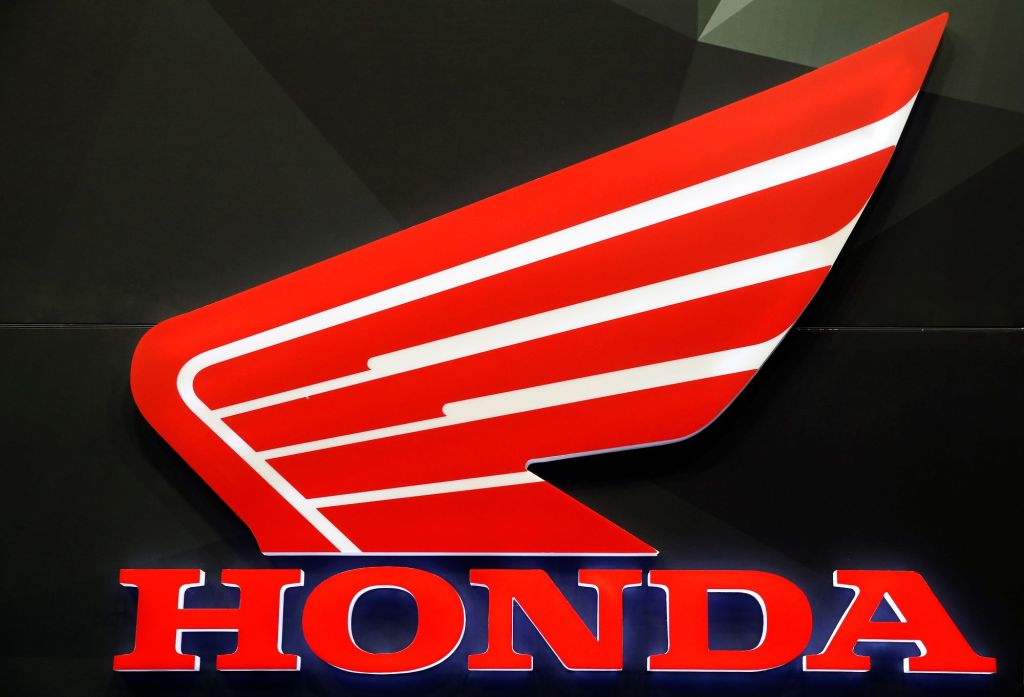 A red and white Honda motorcycle logo on a black background. 