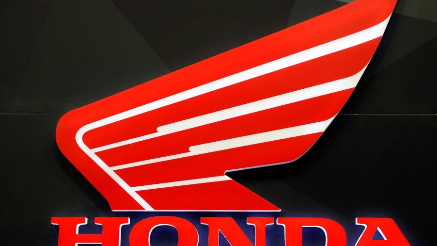 A red and white Honda motorcycle logo on a black background.