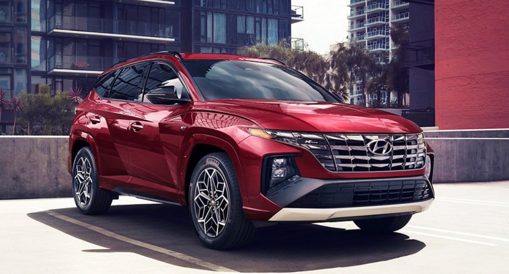 A red 2022 Hyundai Tucson on the street.