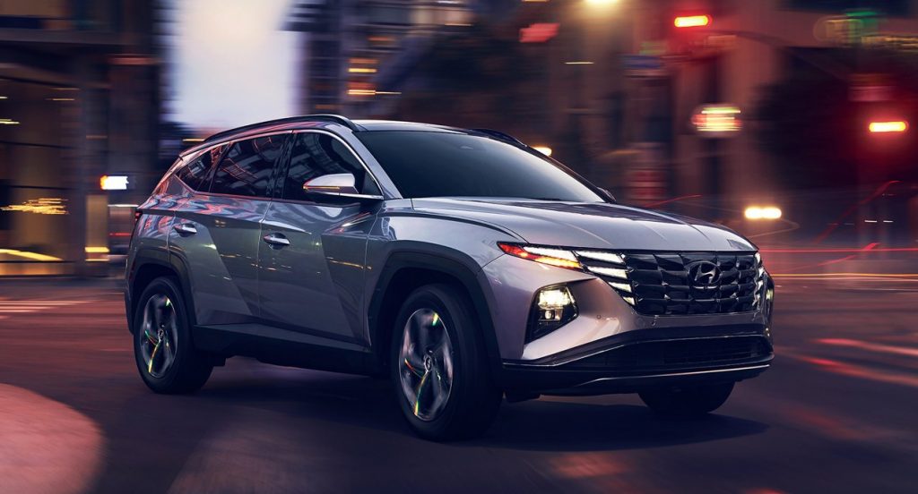 A gray 2022 Hyundai Tucson is driving. 