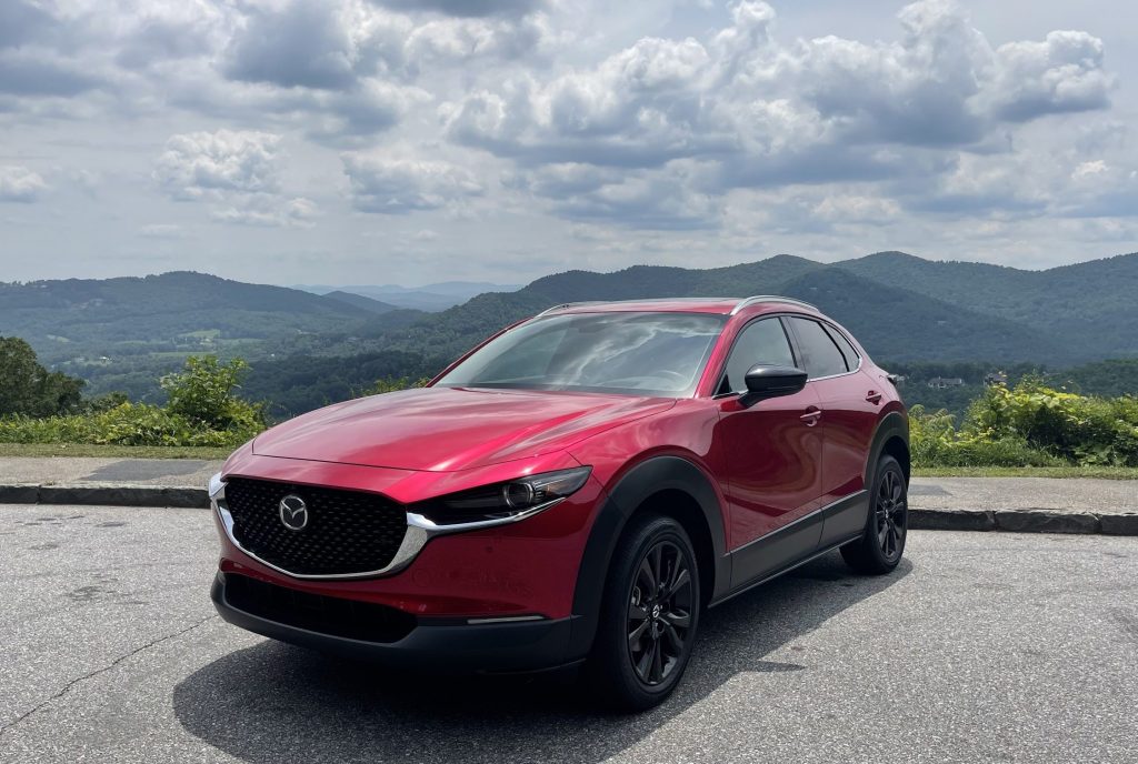 The 2021 Mazda CX-30 parked in front of mountains