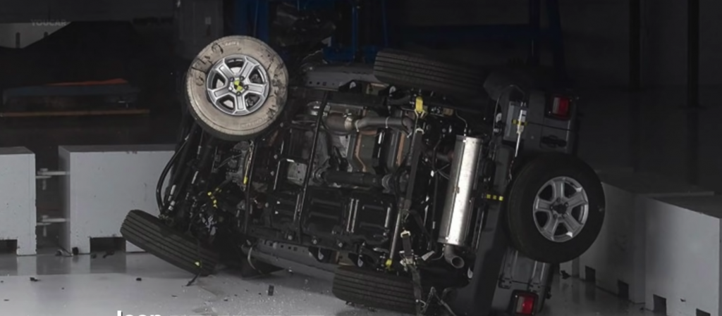 A flipped 2019 Jeep Wrangler sitting on its side after a crash test