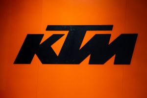 KTM logo written out in black on an orange background. 