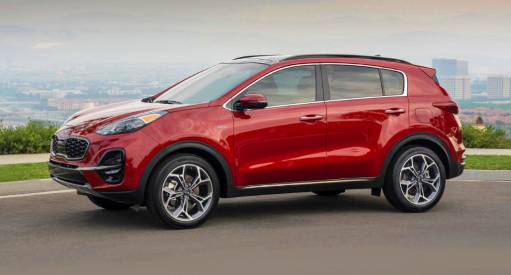 A red 2022 Kia Sportage is parked. 