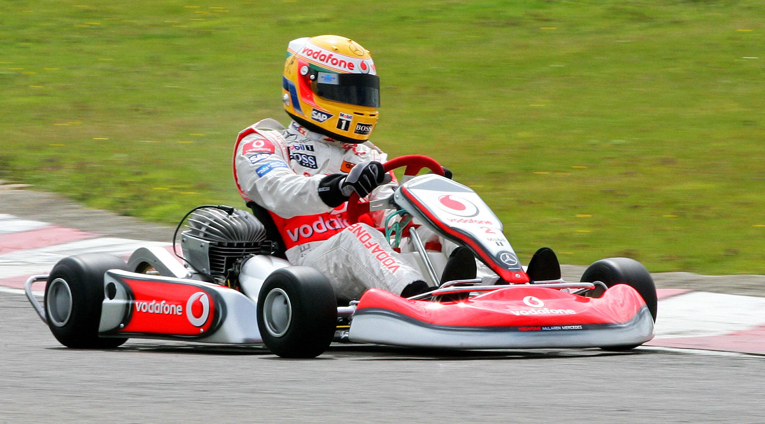 Racing driver and Formula 1 star Lewis Hamilton races a go kart