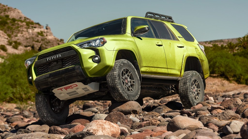 Lime Rush 2022 Toyota 4Runner TRD Pro driving over rocky terrain