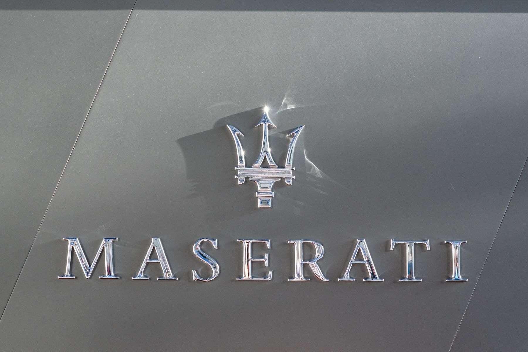 The Maserati logo and lettering of the Italian automotive manufacturer seen at the Shanghai Pudong International Airport