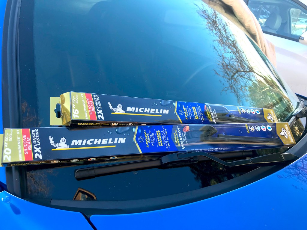 The Michelin Endurance XT wipers are in their original packaging and sitting on a windshield.