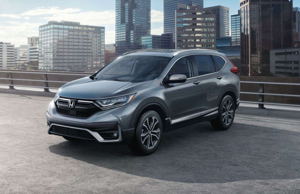 Modern Steel Metallic 2022 Honda CR-V with a city skyline in the background