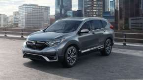Modern Steel Metallic 2022 Honda CR-V with a city skyline in the background