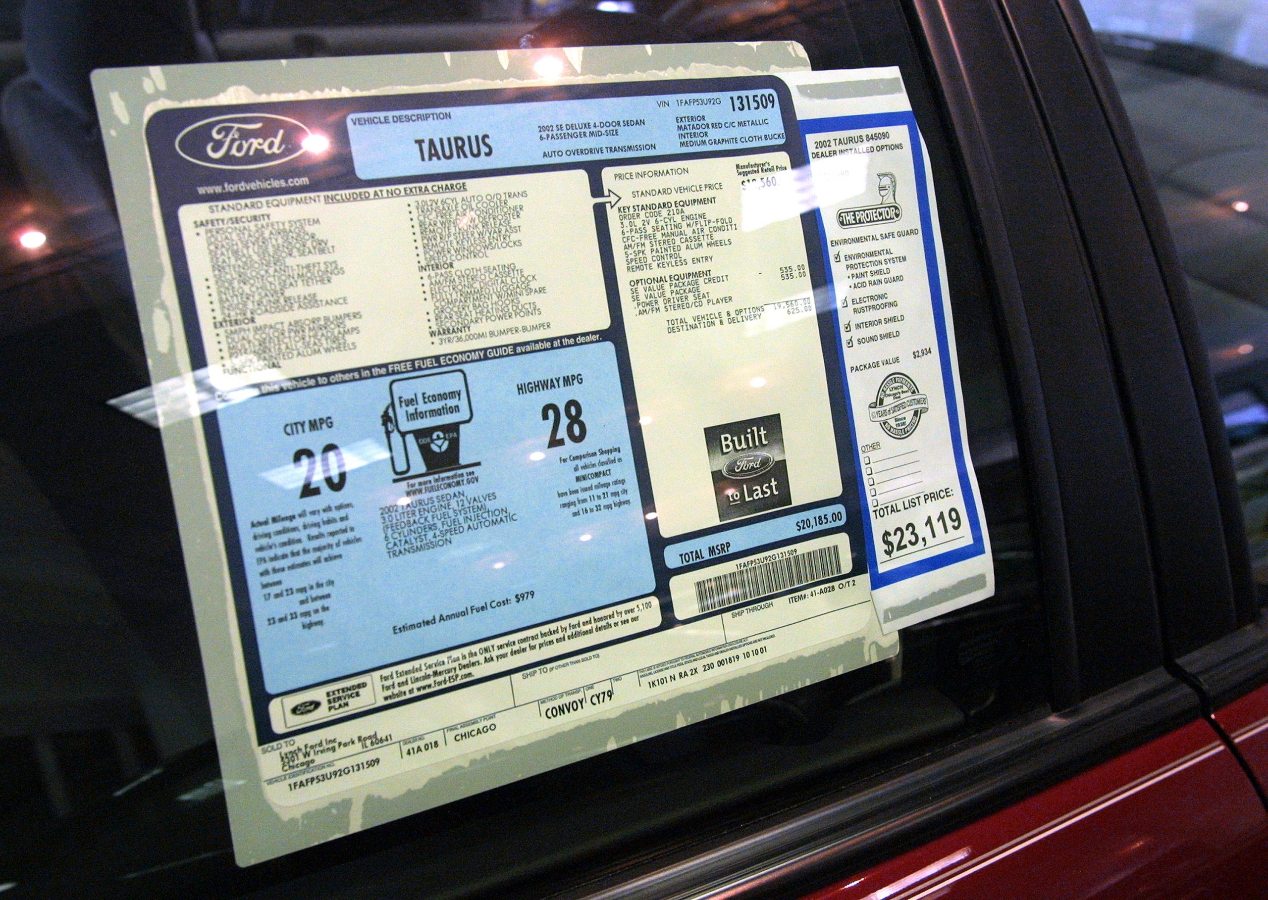 The window sticker of a 2003 Ford showing an MSRP of $23,119, now the price of a used car has surged well above that.