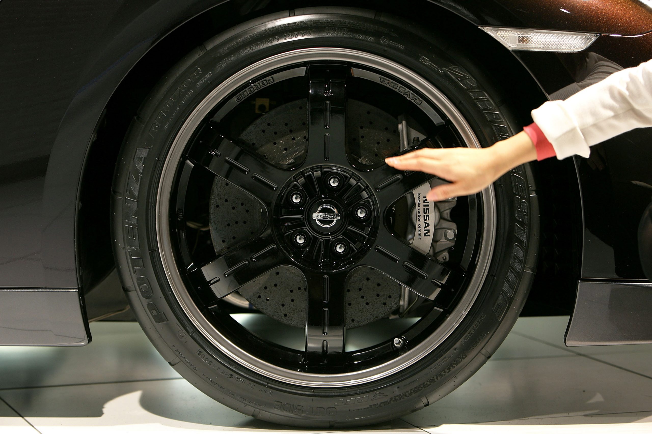 Brembo carbon ceramic brakes on a Nissan GT-R branded with the Nissan logo