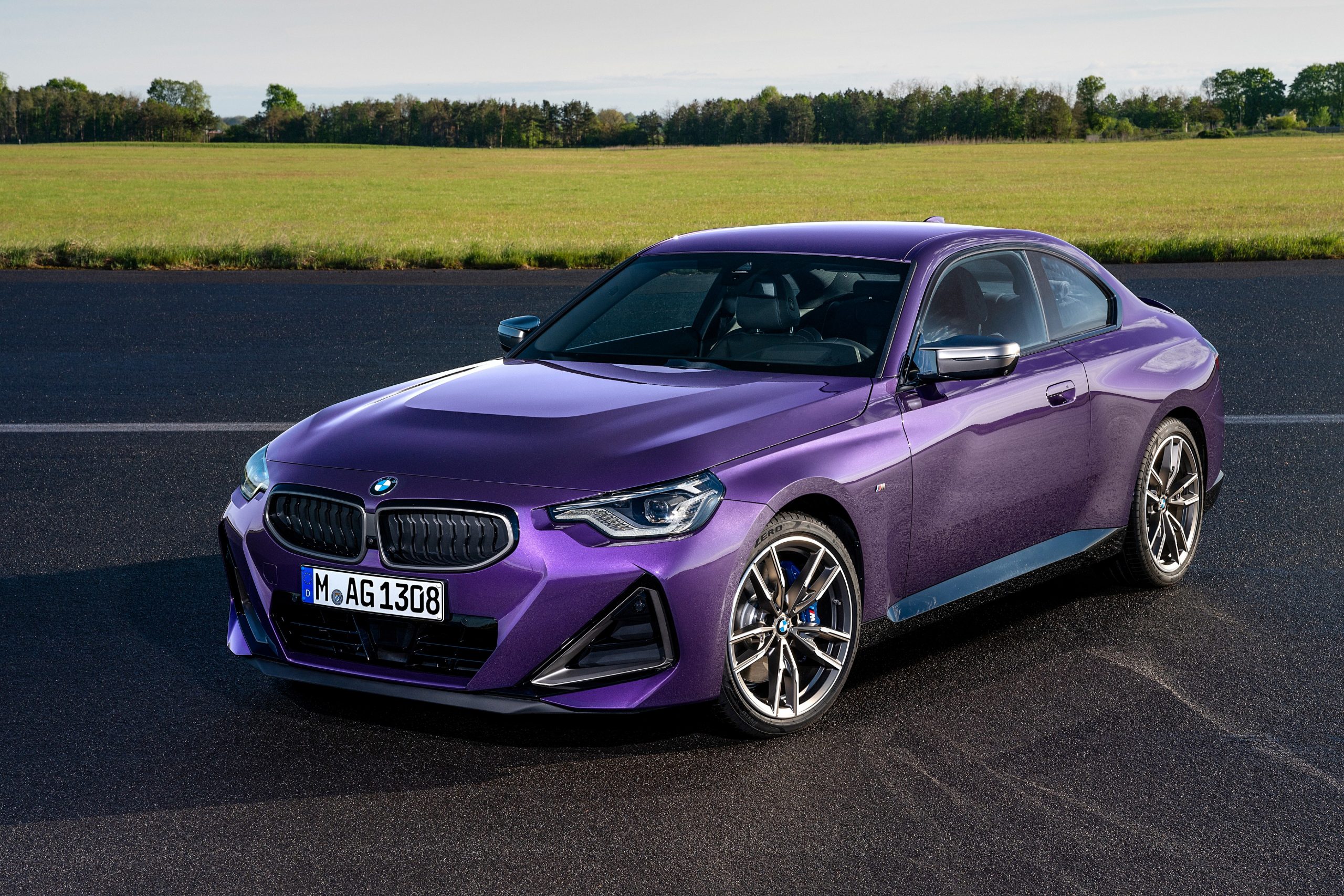A 3/4 front view of a Thundernight Purple 2022 BMW 2 Series Coupe