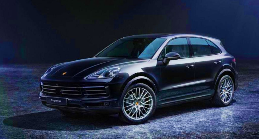 A black 2022 Porsche Cayenne Platinum Edition luxury SUV is parked.
