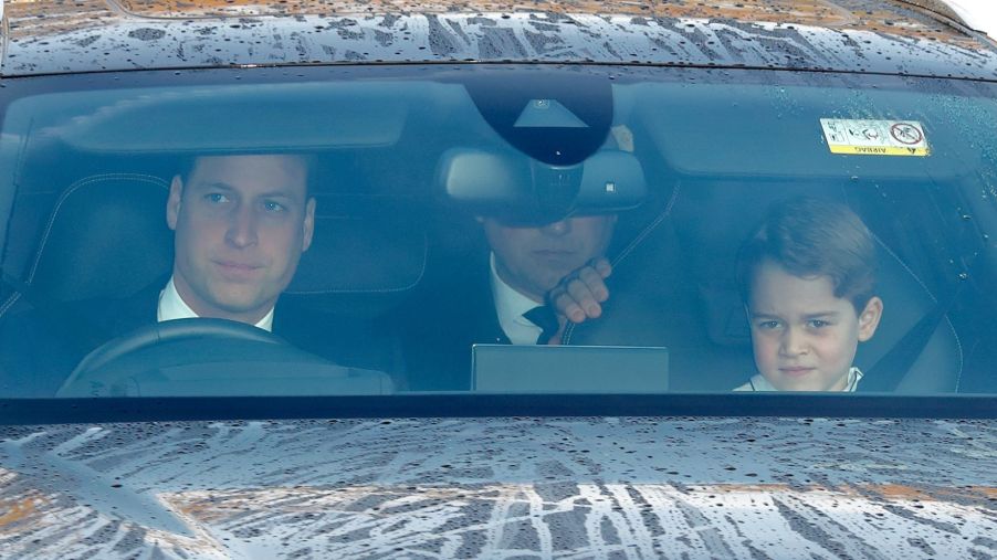 Prince William driving and Prince George in the passenger seat on the way to a Christmas lunch for royal family members in London, United Kingdom (U.K.)