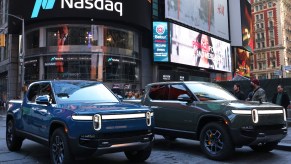 Rivian R1Ts are parked near the Nasdaq MarketSite building in Times Square.