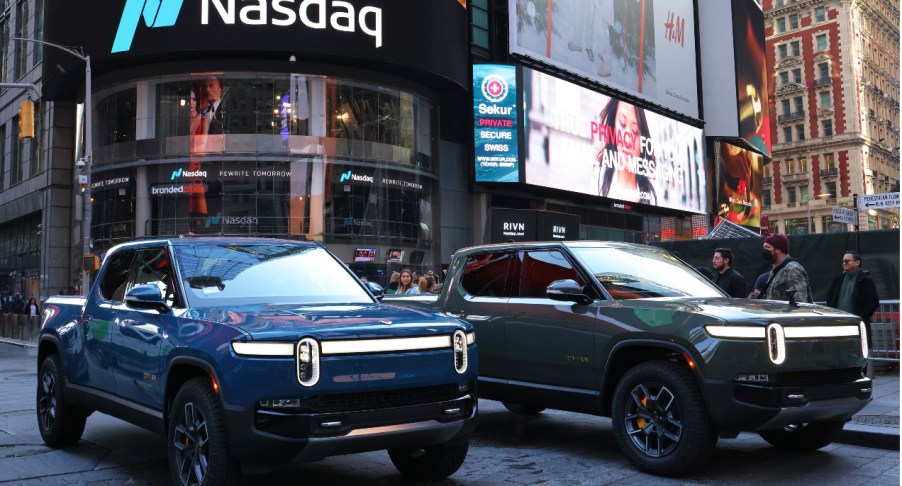 Rivian R1Ts are parked near the Nasdaq MarketSite building in Times Square.