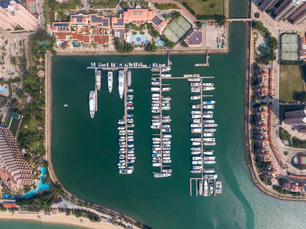 Rows of yachts in a marina area at dock.