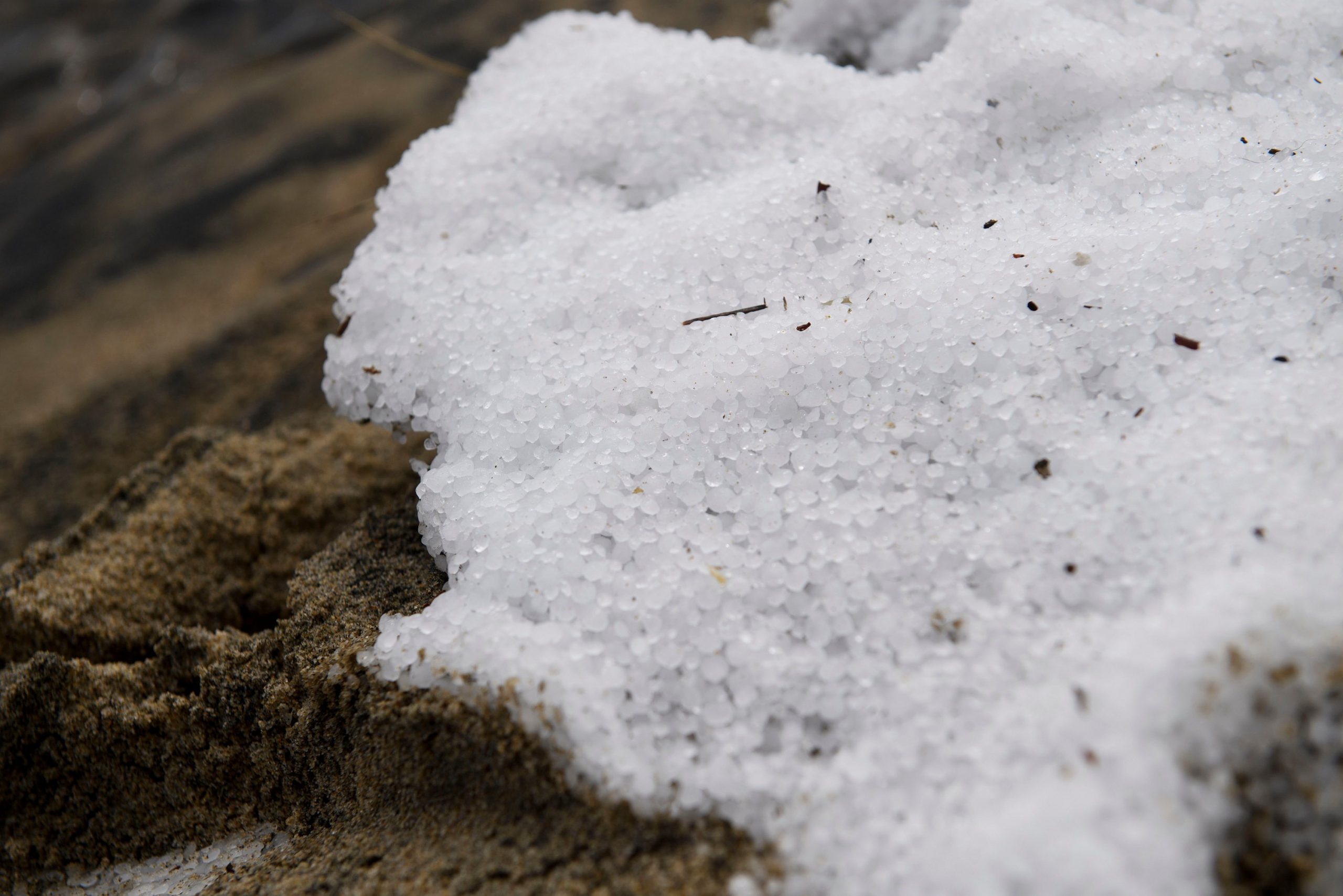 Sand sits under snow