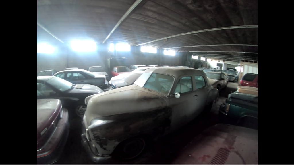 Room full of dusty barn finds at abandoned auto shop