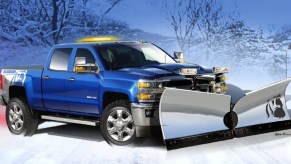 A blue Chevy Silverado with a snowplow.