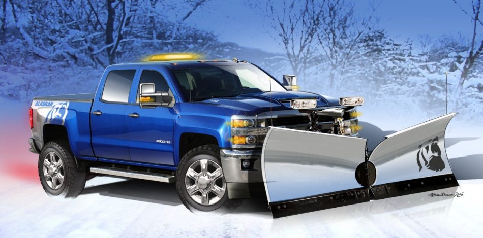 A blue Chevy Silverado with a snow plow attached.