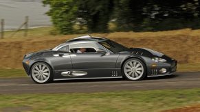 A Spyker C8, one of many forgotten sports cars, makes a run up the Hill at Goodwood