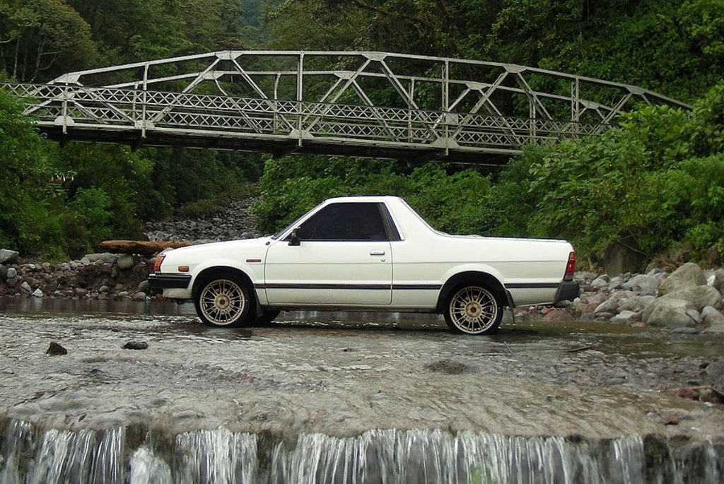 White Subaru Brat parked in a creek