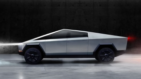 A Tesla Cybertruck against a black background.