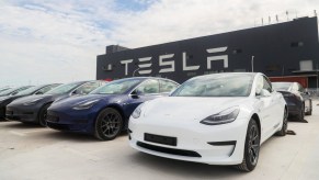 A line of Tesla Model 3 electric vehicles.