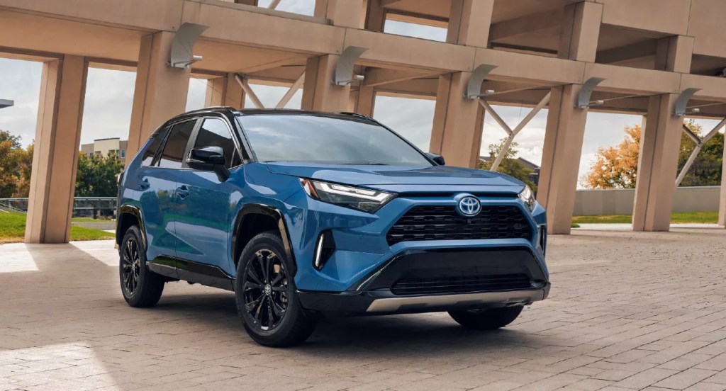 A blue 2022 Toyota RAV4 Hybrid SUV is parked.