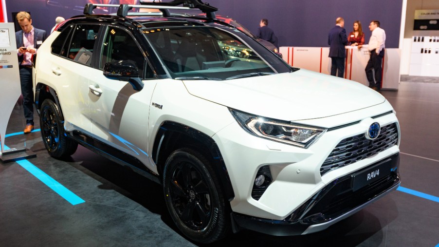 A white 2022 Toyota RAV4 Hybrid is on display.