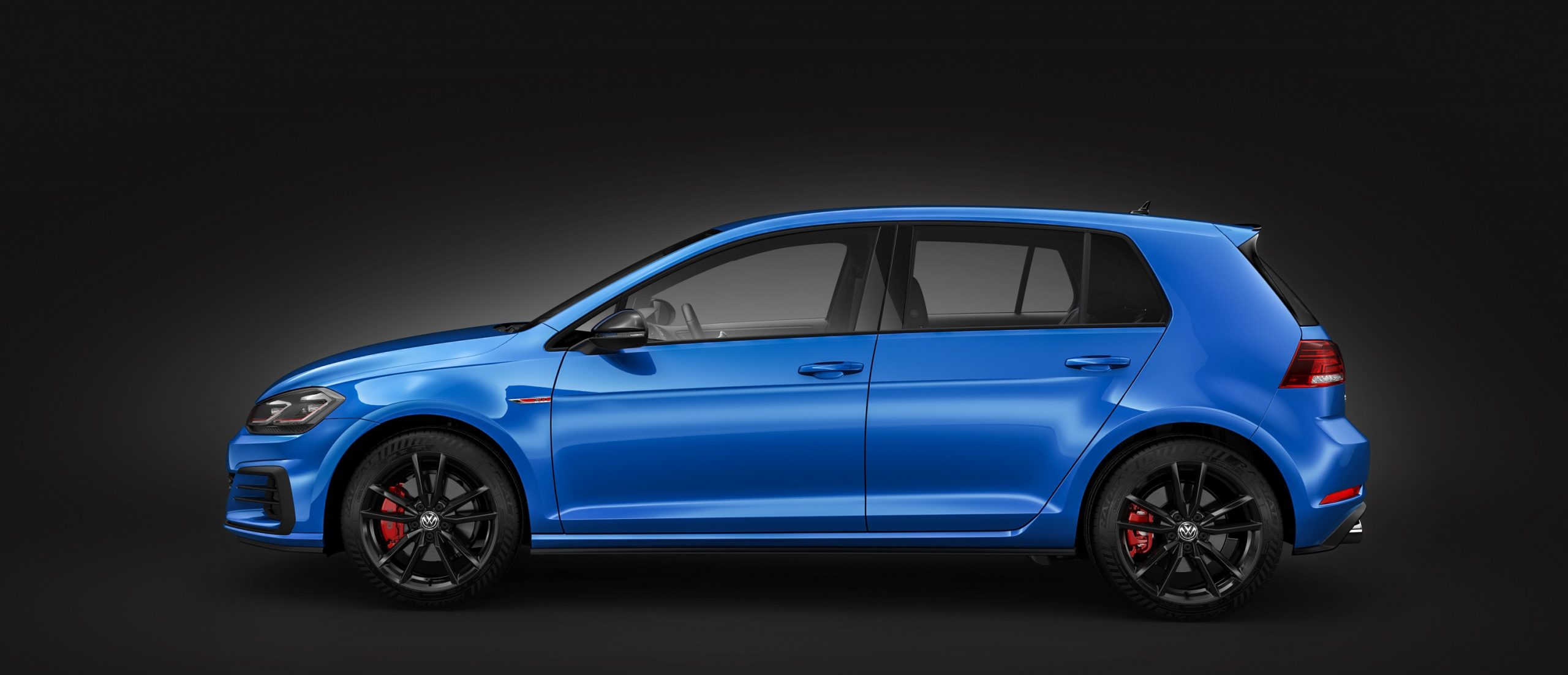 The Honda Civic Type R's main competitor, the Volkswagen GTI, shot in profile with Cornflower Blue paint