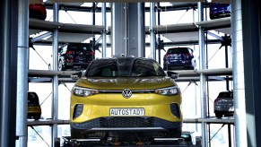 A yellow Volkswagen ID.4 SUV electric automobile is on display at the storage facility auto tower of German carmaker Volkswagen.