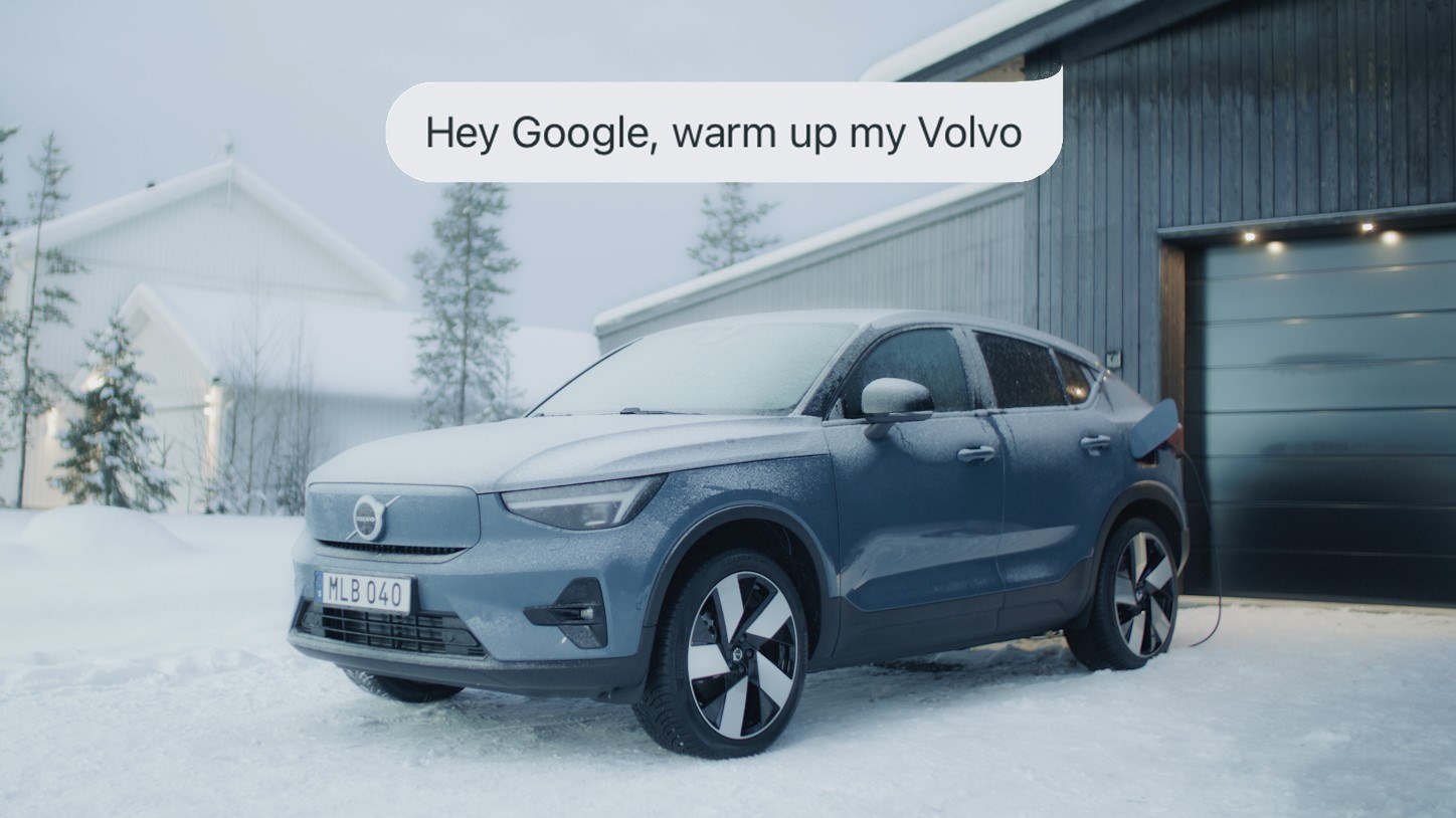A new Volvo car shown during a snowstorm with the overlayed text: Hey Google, warm up my Volvo