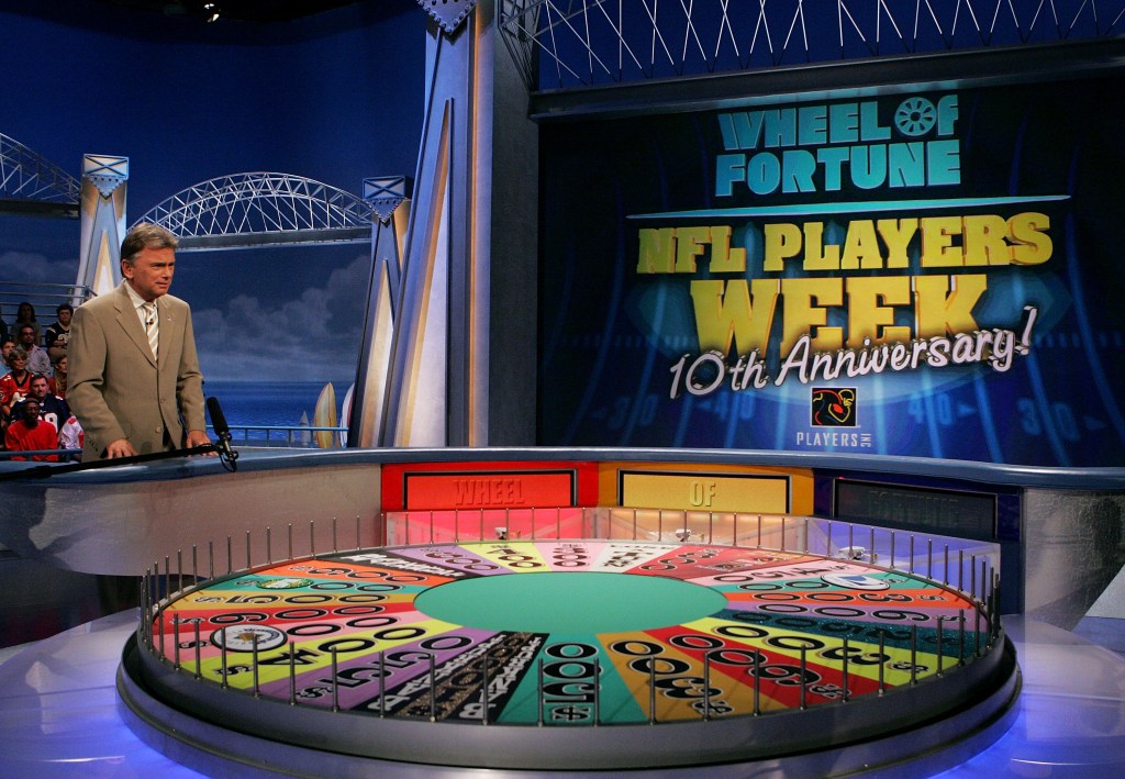 Host Pat Sajak performs during a taping of the NFL Players Week 10th Anniversary on Wheel Of Fortune. 