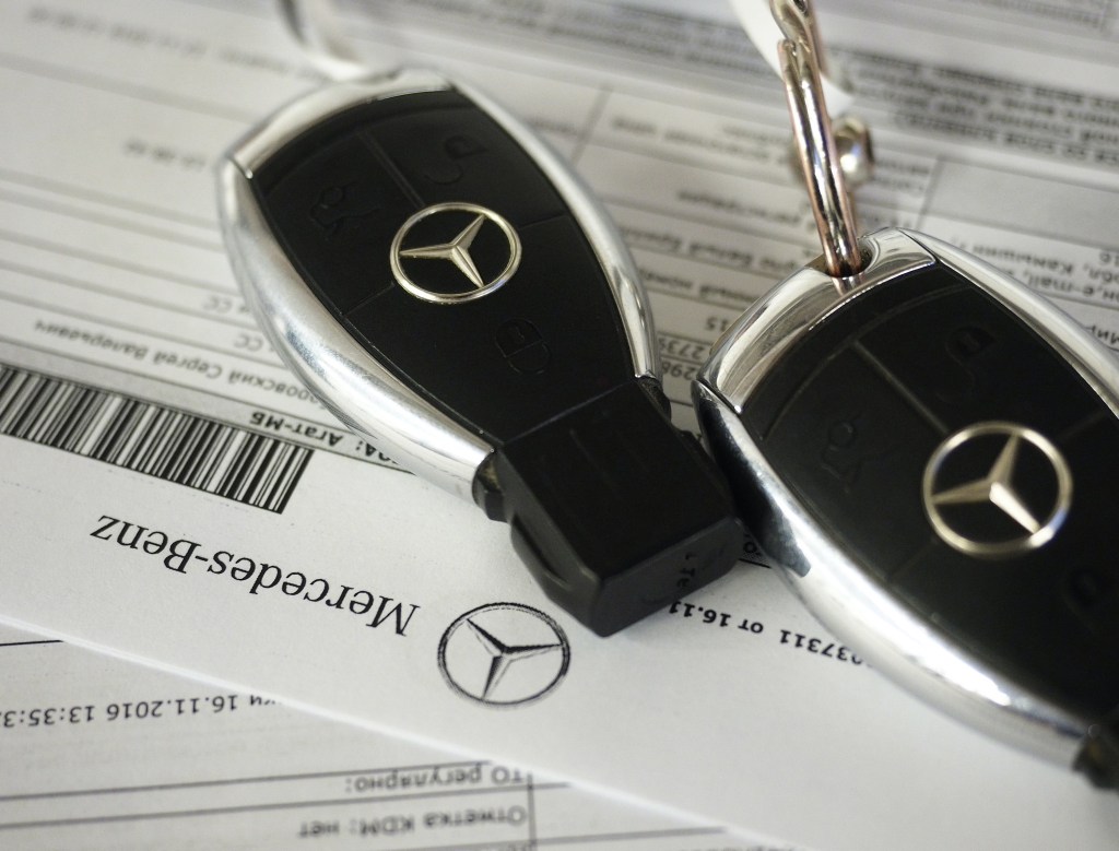  Key chains bearing the Mercedes-Benz logo at a Mercedes-Benz car dealership.
