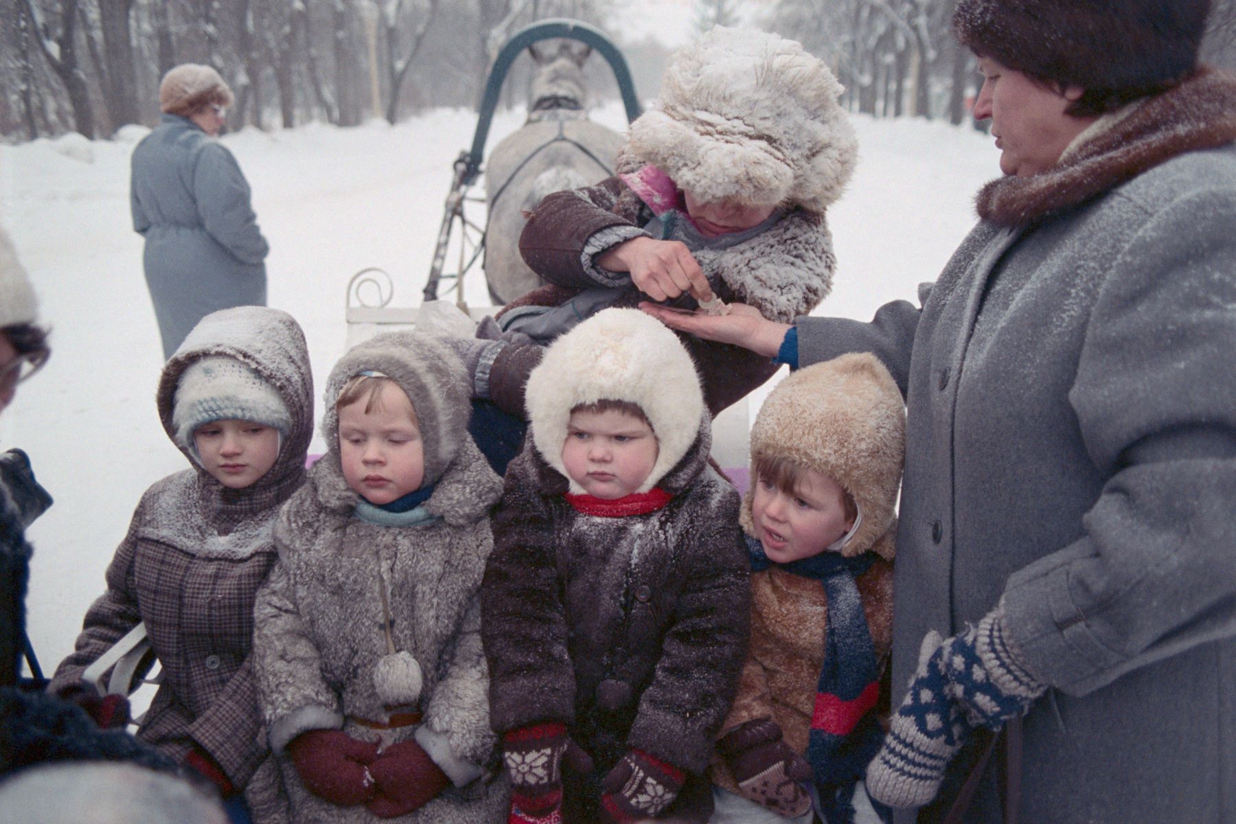 Children bundled up in winter coats in Moscow, Russia