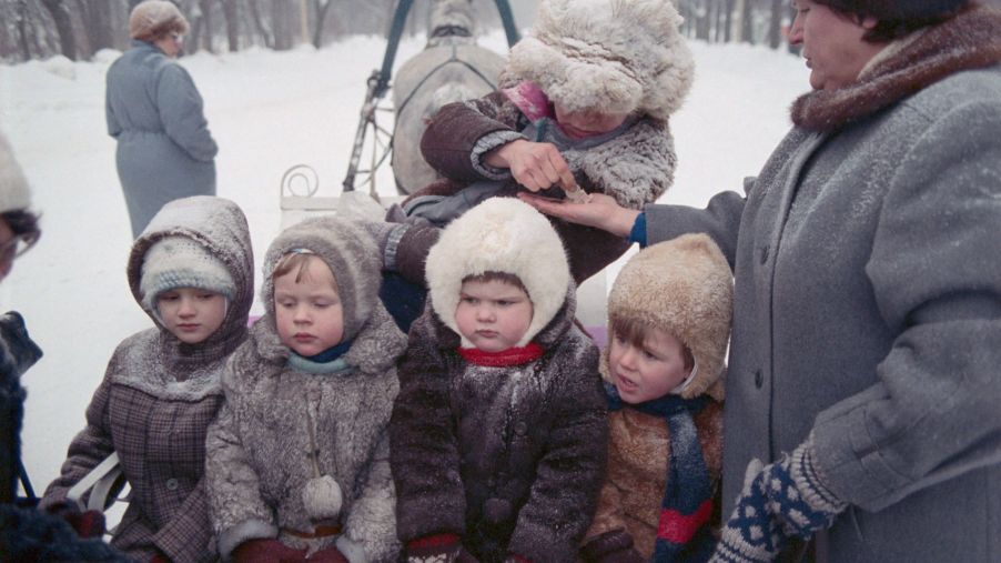 Children bundled up in winter coats in Moscow, Russia