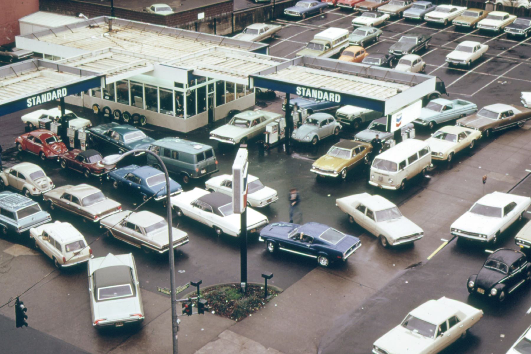 An overhead aerial shot of a crowded Chevron gas station in the morning in Portland, Orgeon