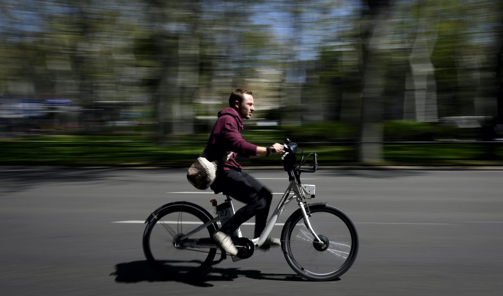  A man rides an e-Bike in Madrid, Spain. 