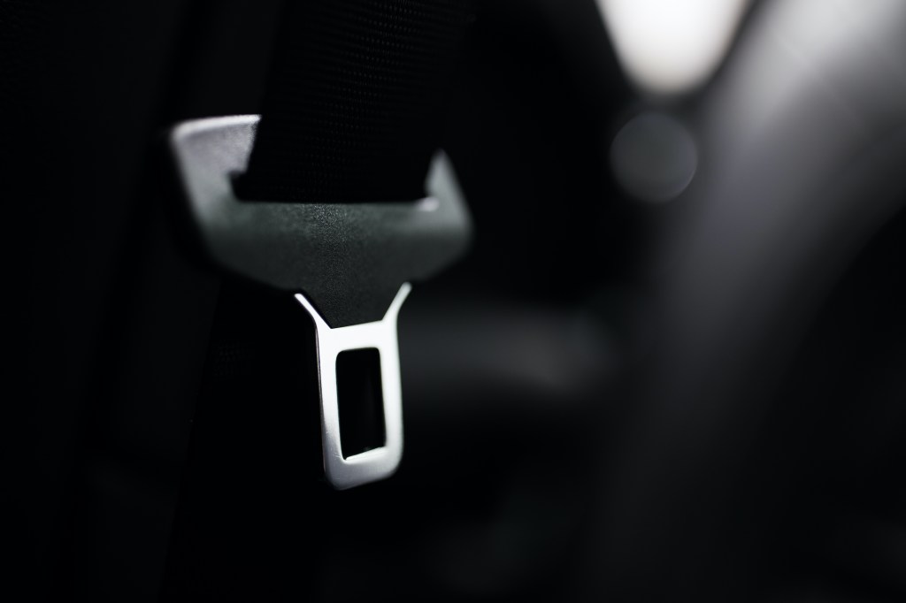 A seat belt latch in a car. 