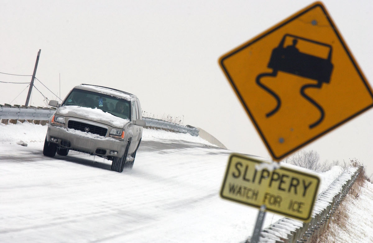 An SUV drives on an icy road in Toledo, Ohio, in winter 2005