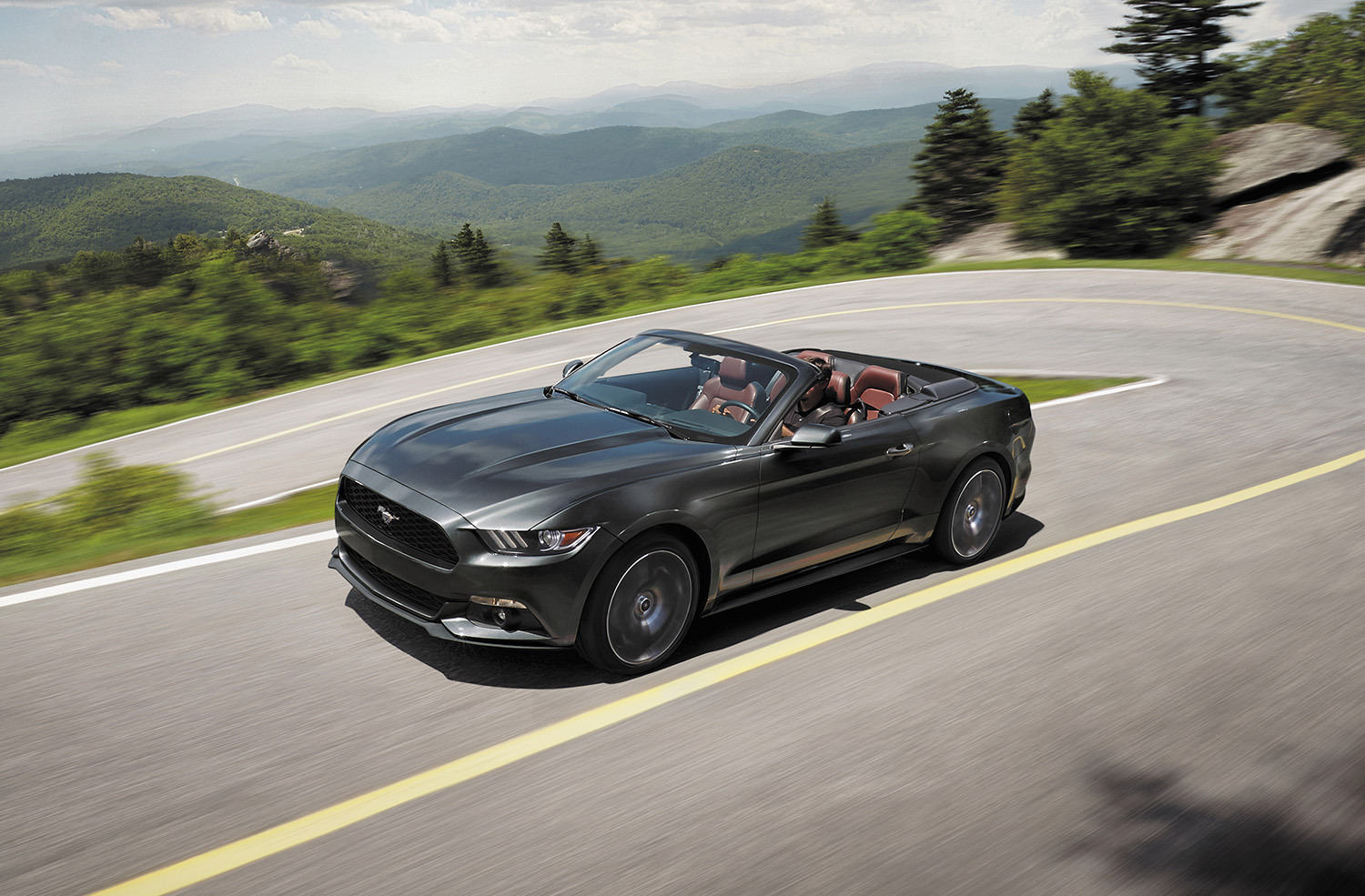 2017 Ford Mustang GT Convertible driving on mountain road