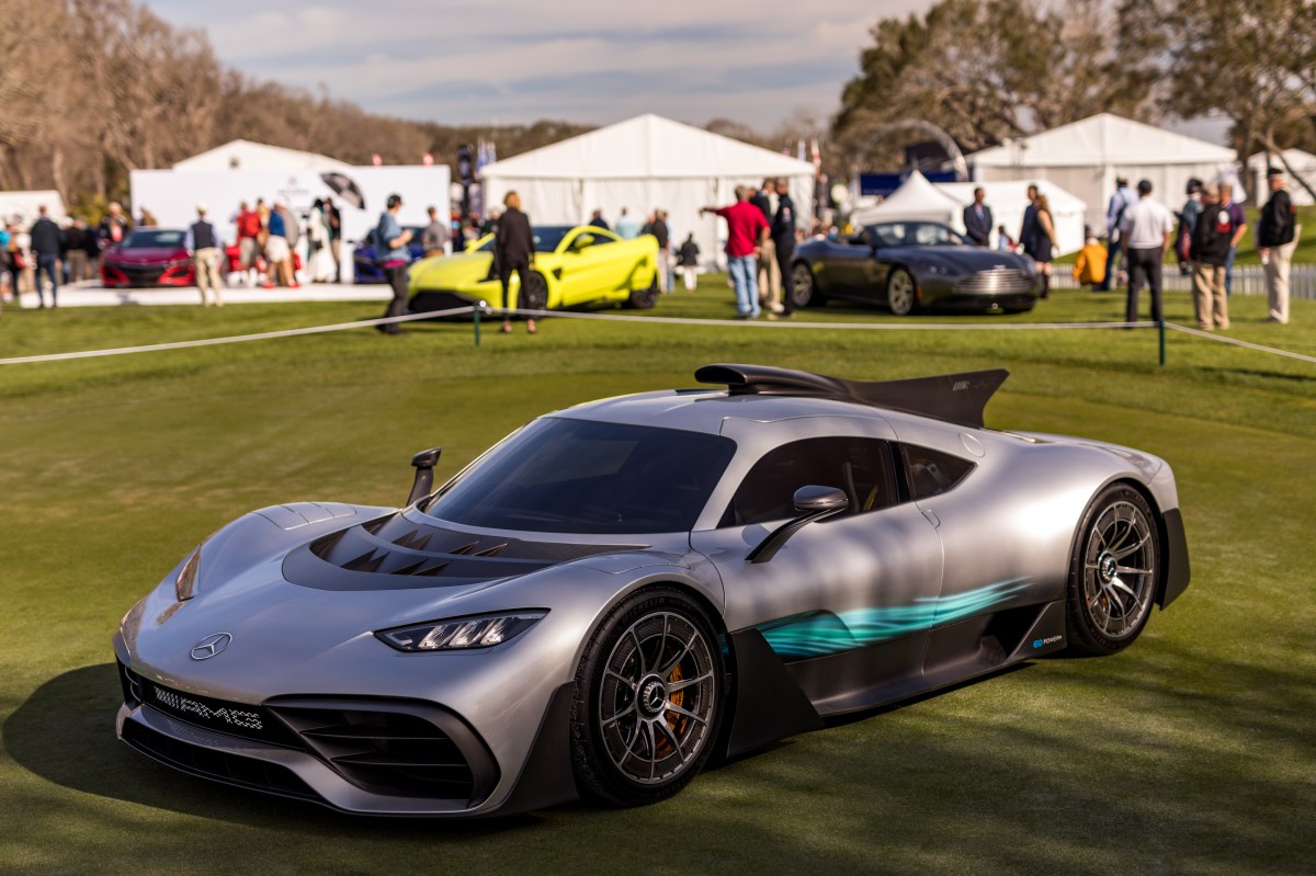A 3/4 front view of a Mercedes-AMG ONE supercar at the Amelia Island Concours d'Elegance.