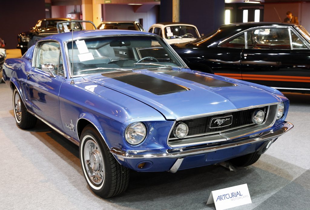 A blue 1968 Ford Mustang 289 Fastback at a classic car auction